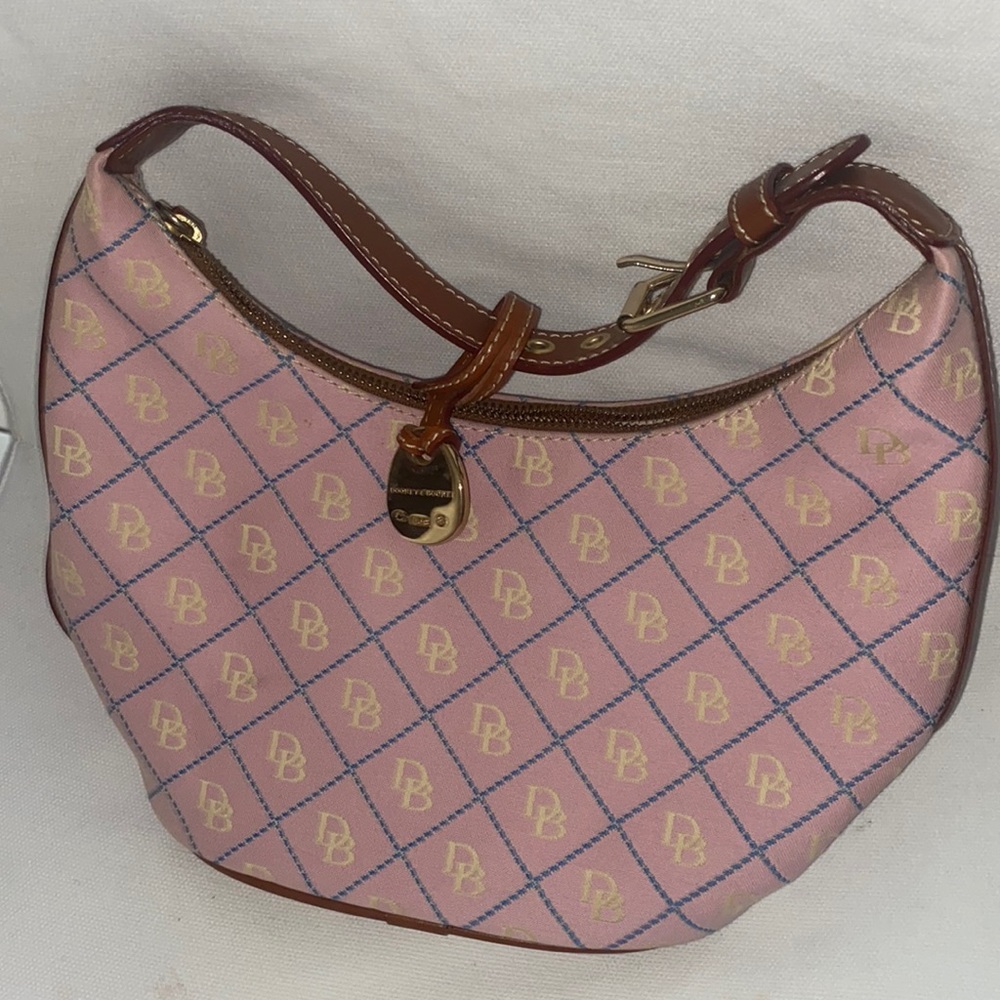 Pink, small Dooney, and Bourke purse.